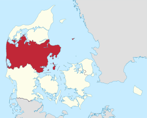 Billedet viser et kort med Region Midtjylland fremhævet med rødt. De omkringliggende områder og vandområder er vist i en lys grundfarve.